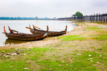 Wooden boats at the famous Ubeng Bridge in Mandalay
