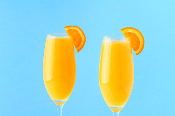 Yellow cocktail on a bright background.