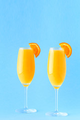Yellow cocktail on a bright background.