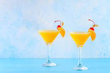 Yellow cocktail on a bright background.