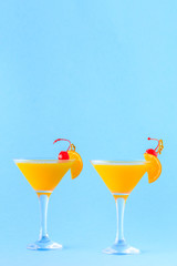 Yellow cocktail on a bright background.