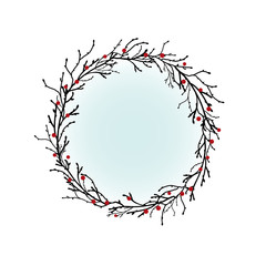 Round Wreath with black branches and twigs and red berries.
