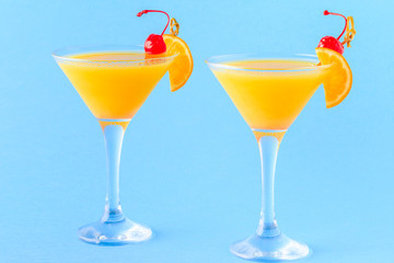 Yellow cocktail on a bright background.