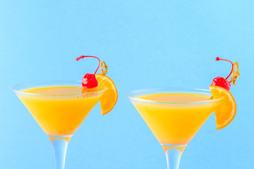 Yellow cocktail on a bright background.