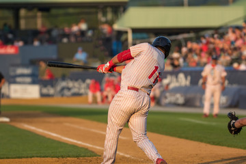 baseball player swinging at a pitch