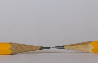 A group of pencils isolated on white. The pencils tips are nearly touching each other. This is a...