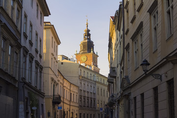 Fototapeta na wymiar view on Bracka street and city hall in background, Krakow, Poland, warm colors