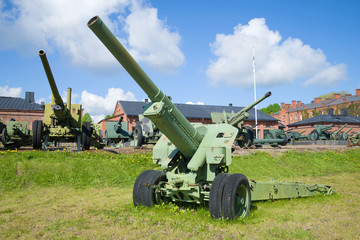 Fototapeta premium Artillery gun of the Second World War period close-up on a sunny summer day. Hameenlinna, Finland