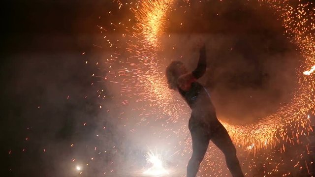 Fire show and a lot of the bright sparks in the night.