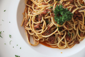 Spaghetti bolognese with beef tometo sauce on wood table , italian food
