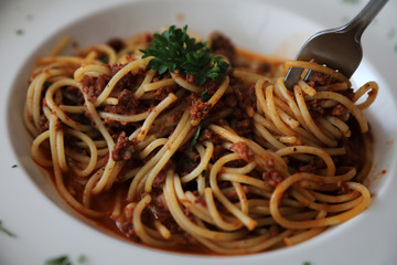 Spaghetti bolognese with beef tometo sauce on wood table , italian food