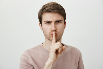 You will keep mouth shut about out business. Portrait of strict serious man with confident...