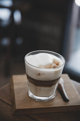 cappuccino or Latte art coffee made from milk on the wood table in coffee shop