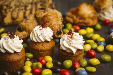 Set of cakes on a dark background.