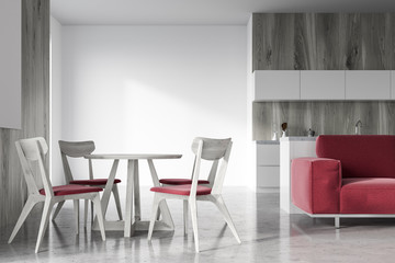 Wooden dining room, red sofa