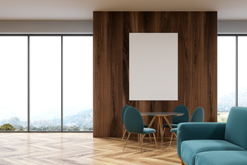 Wooden dining room, green sofa, poster side