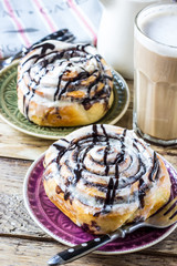 Cinnamon rolls or cinnabons with cream sauce