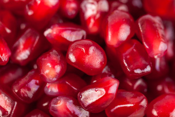 Close up of fresh organic pomegranate seeds, fruit