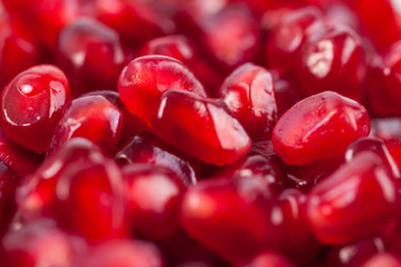Close up of fresh organic pomegranate seeds, fruit