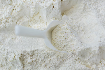 spoon with white flour texture ready for cooking