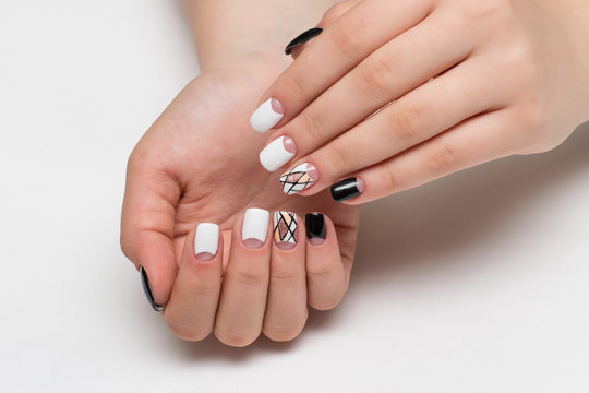 white black manicure with a delicate design of stripes, sequins, geometry on square nails