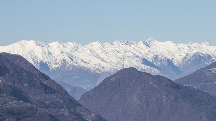 European alps full of snow in a blue sky