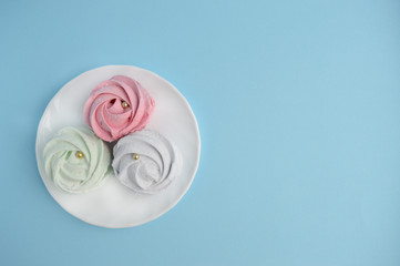 Homemade sweets marshmallow . Delicate Zephyr on a pink background. Minimalistic background