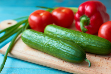 Bright and juicy vegetables on a cutting board.