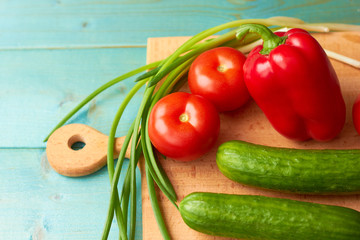 Bright and juicy vegetables on a cutting board.