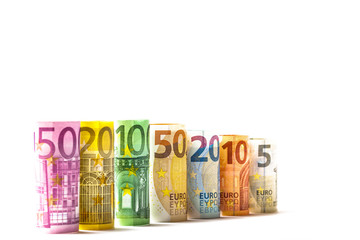Obraz na płótnie Canvas Several hundred euro banknotes stacked by value.Rolls Euro bankn