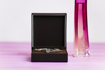 silver bracelet with a diamond in a box