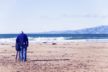 family father and son on the beach view