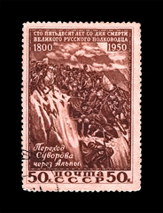 Alexander Suvorov (1730-1800), famous russian military commander, marshal, soldiers crossing the Alps mountain, circa 1950. canceled vintage post stamp printed in USSR isolated on black background. 