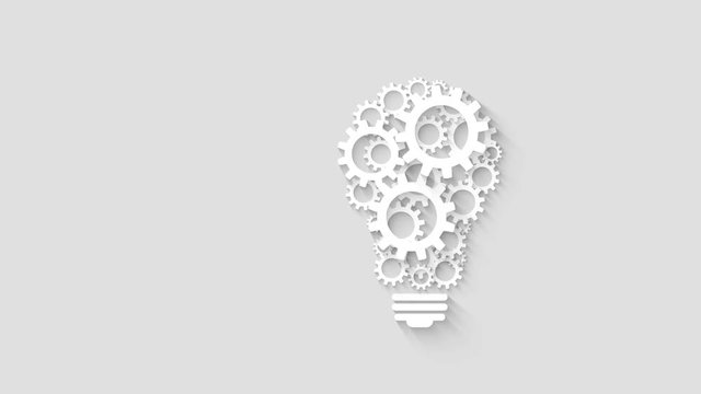 light bulb design by rotating cogs and gears on gray background