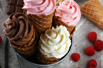 Vanilla frozen yogurt or soft ice cream in waffle cone.