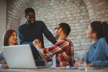 Good news handshake in the office