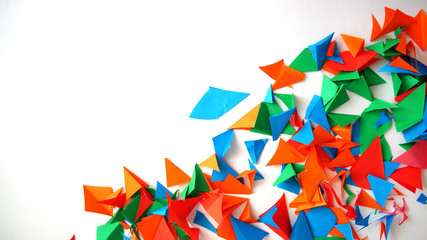 the multi-colored leaflets which are cut out from paper, colourful background, collage