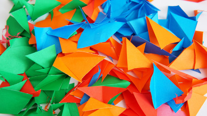 the multi-colored leaflets which are cut out from paper, colourful background, collage