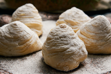 Fototapeta premium Badambura powdered pastry on Novruz tray. Azerbaijan traditional pastry cookie badambura on rustic table background