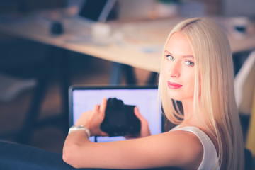 Young photographer and graphic designer at work