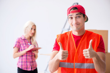 Young delivery assistant delivering to home