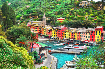 The beautiful Portofino panorama with colorfull houses, luxury boats and yacht in little bay...