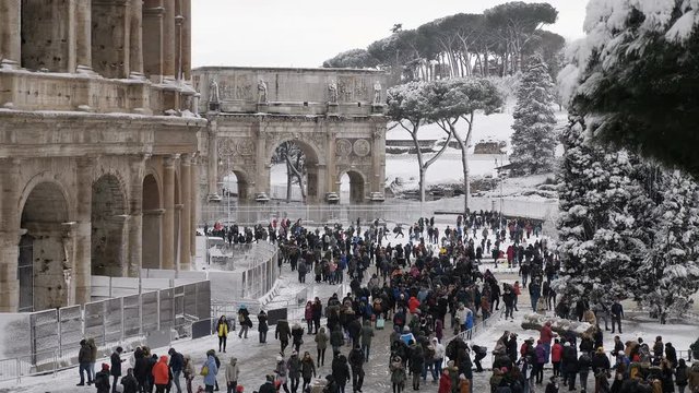 snowfall in Rome tourists at the colosseum - 26 February 2018, Rome, Italy