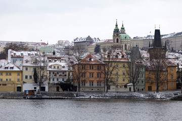 Snowy Prague Lesser Town with St. Nicholas' Cathedral, Czech republic