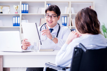 Female patient visiting male doctor for regular check-up in hosp