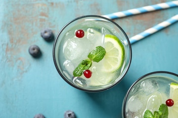 Glasses of fresh lemonade on table