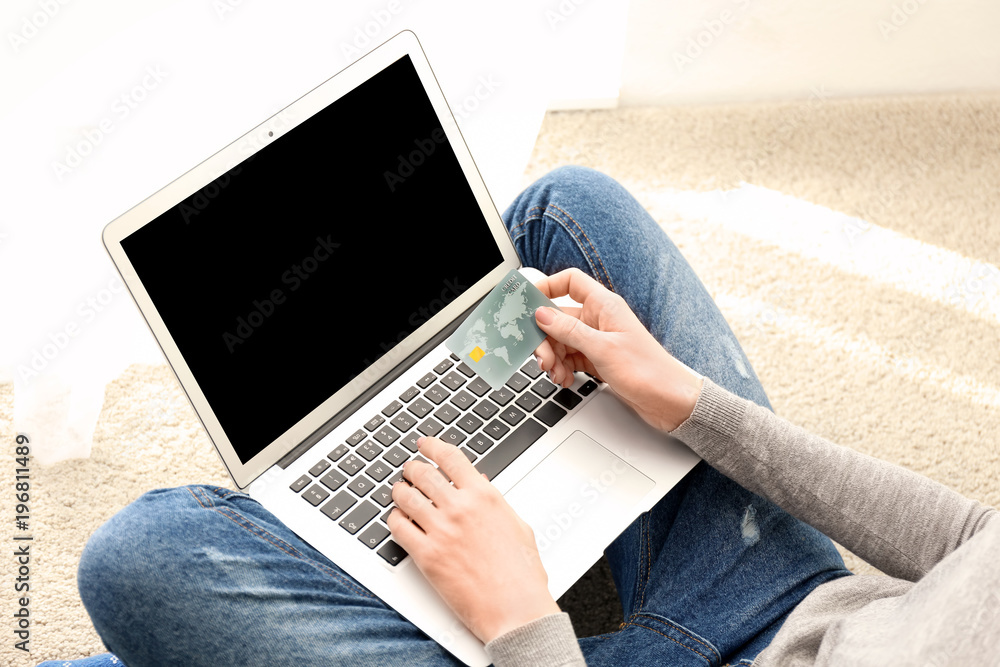 Canvas Prints woman with credit card using laptop indoors