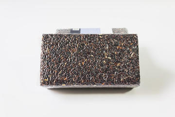 Organic natural riceberry on white background, purple rice