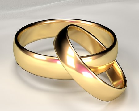 A gold wedding ring embedded with a silver ring.  White background
