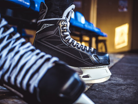 close up hockey player ice skates in the locker room
